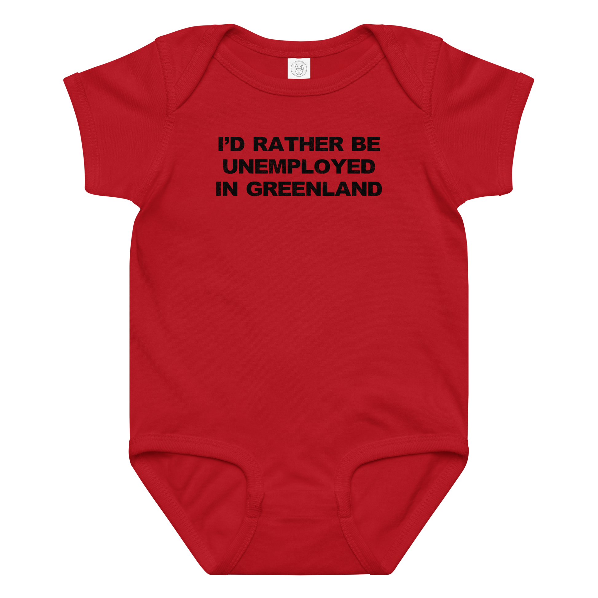 "I'd rather be unemployed in greenland" printed on a red baby jersey bodysuit laying on a flat surface amongst other clothes