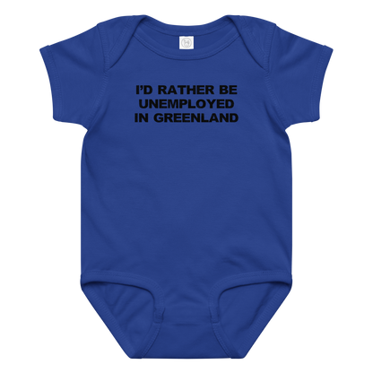 "I'd rather be unemployed in greenland" printed on a royal baby jersey bodysuit laying on a flat surface amongst other clothes