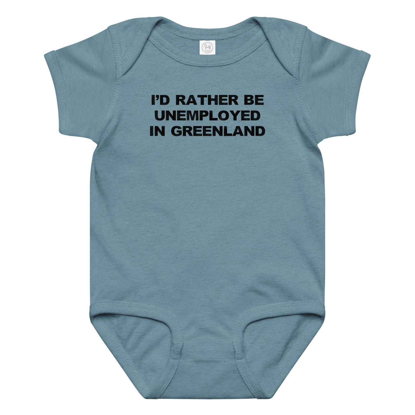 "I'd rather be unemployed in greenland" printed on a vintage indigo baby jersey bodysuit laying on a flat surface amongst other clothes