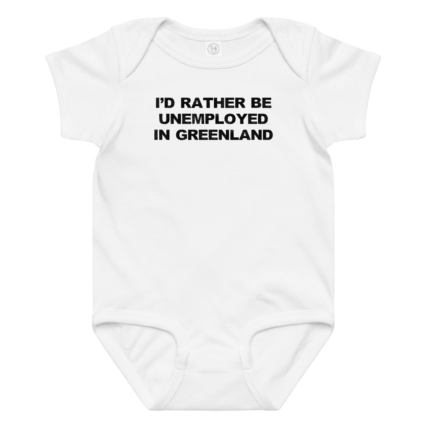 "I'd rather be unemployed in greenland" printed on a white baby jersey bodysuit laying on a flat surface amongst other clothes