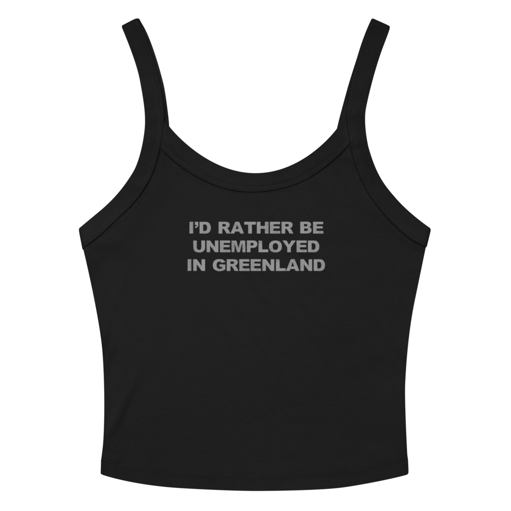 "I'd rather be unemployed in greenland" printed on a solid black blend women's micro-rib tanktop laying on a flat surface amongst sunglasses and shorts