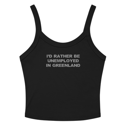 "I'd rather be unemployed in greenland" printed on a solid black blend women's micro-rib tanktop laying on a flat surface amongst sunglasses and shorts