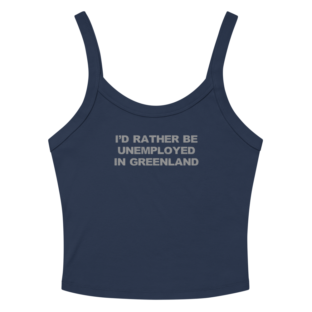 "I'd rather be unemployed in greenland" printed on a solid navy blend women's micro-rib tanktop laying on a flat surface amongst sunglasses and shorts