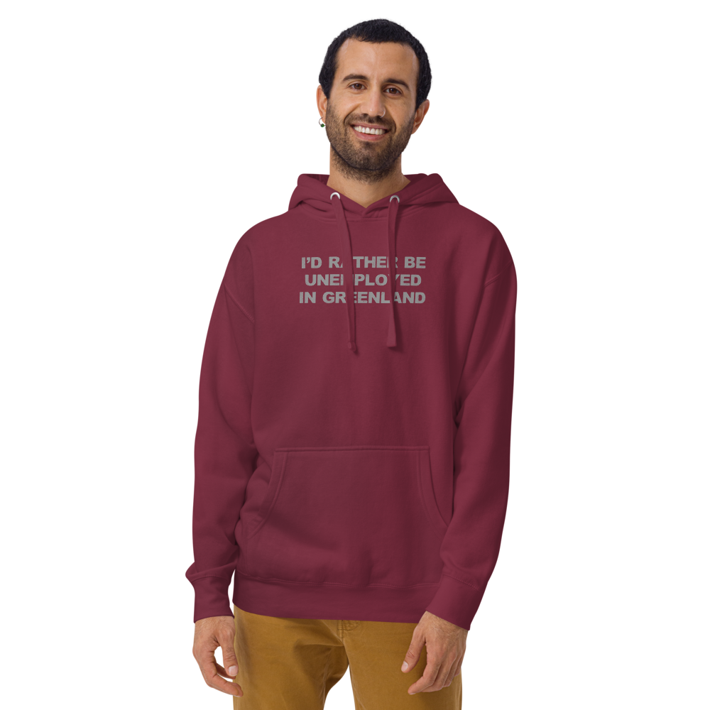 "I'd rather be unemployed in greenland" printed on a maroon warn by a male