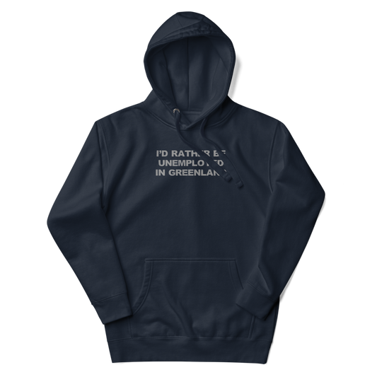"I'd rather be unemployed in greenland" printed on a navy blazer unisex hoodie laying on a flat surface with the hood up