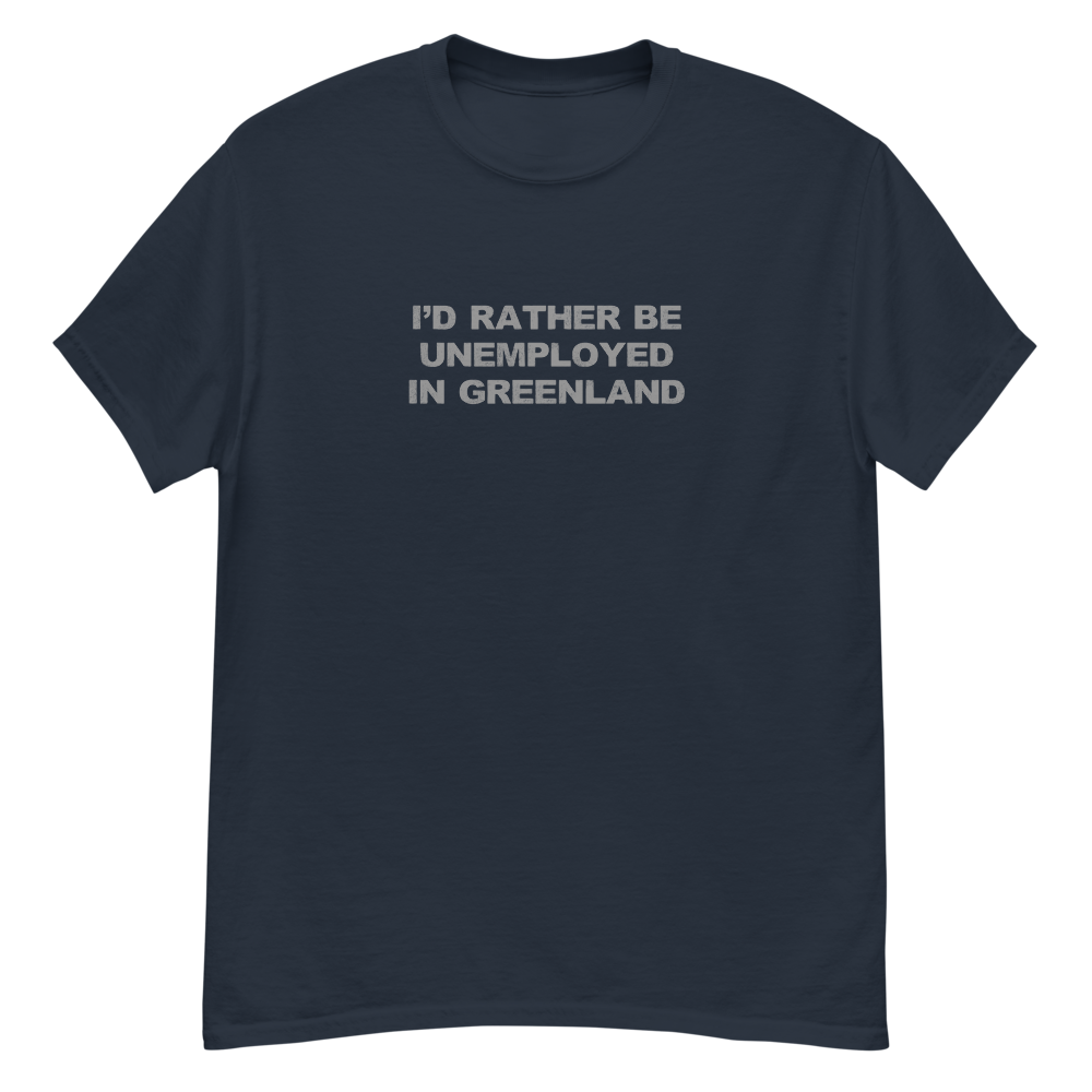 "I'd rather be unemployed in greenland" printed on a navy unisex classic tee laying on a flat surface