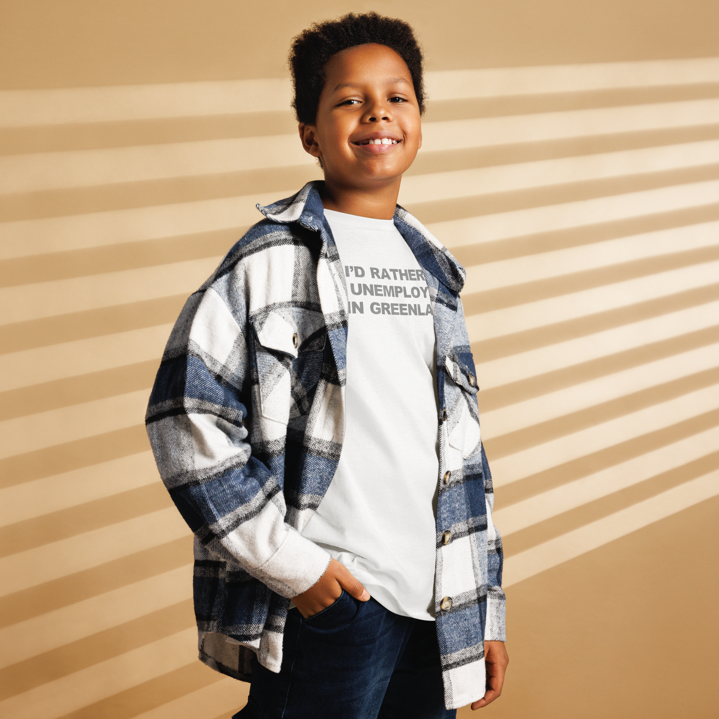 "I'd rather be unemployed in greenland" printed on a white youth classic tee worn by a male also wearing a jacket