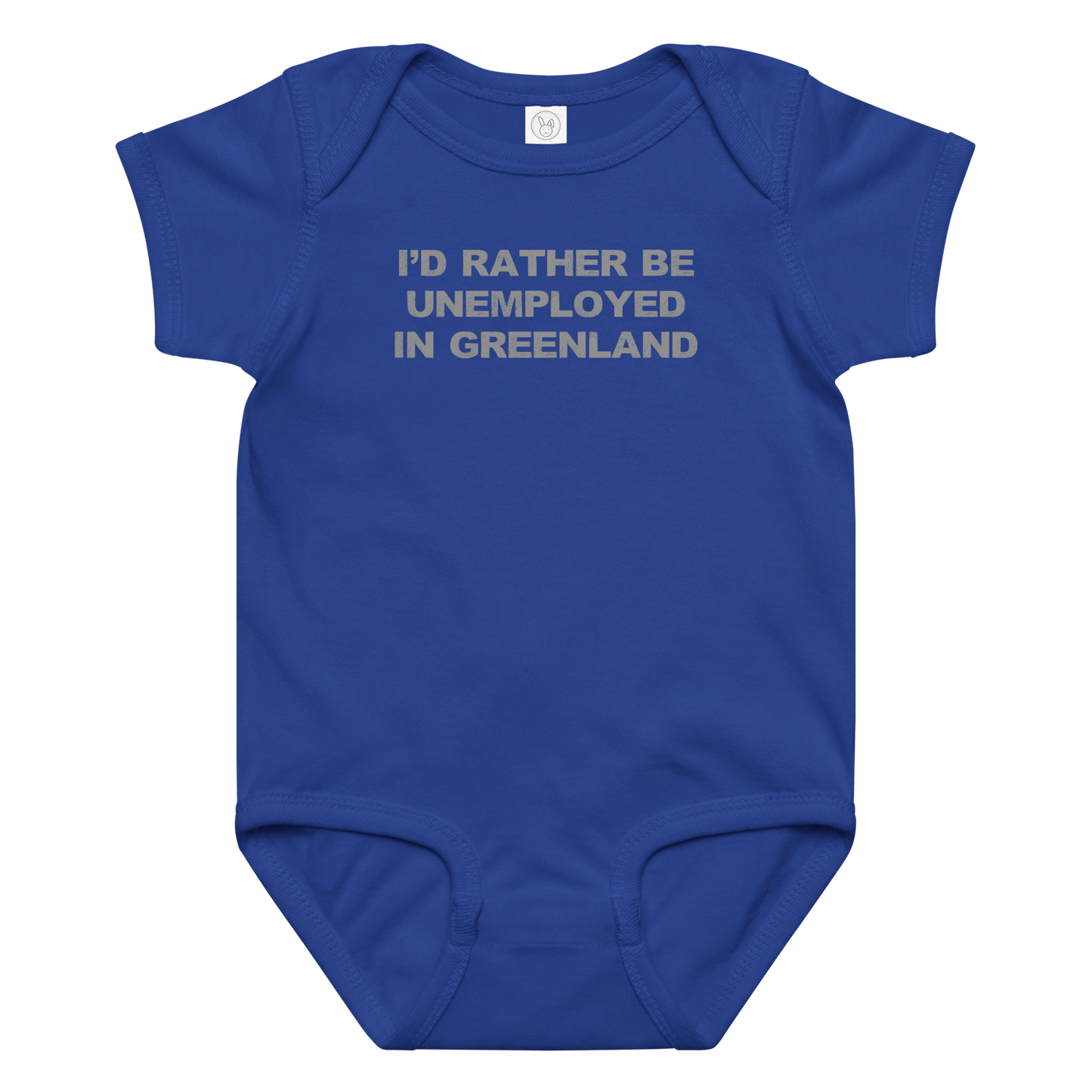 "I'd rather be unemployed in greenland" printed on a royal baby jersey bodysuit laying on a flat surface amongst other clothes
