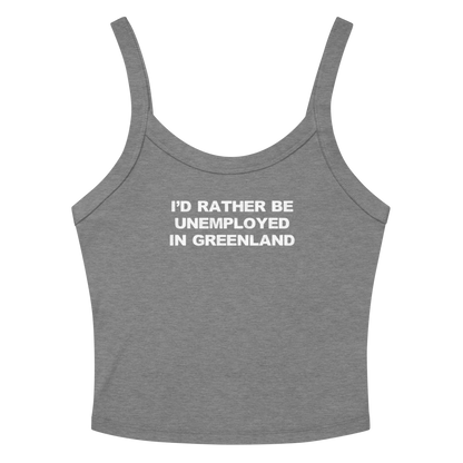 "I'd rather be unemployed in greenland" printed on a athletic heather women's micro-rib tanktop laying on a flat surface amongst sunglasses and shorts