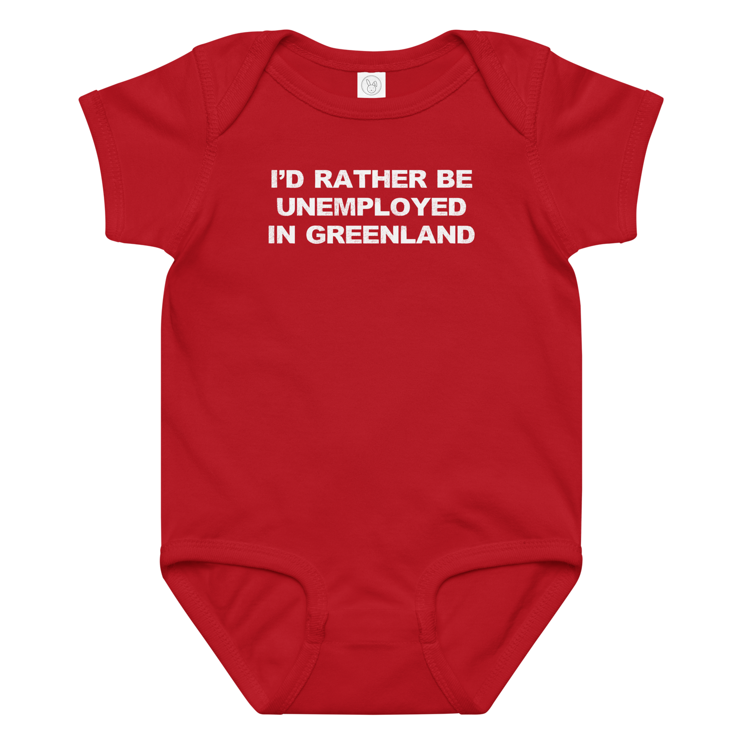"I'd rather be unemployed in greenland" printed on a red baby jersey bodysuit laying on a flat surface amongst other clothes