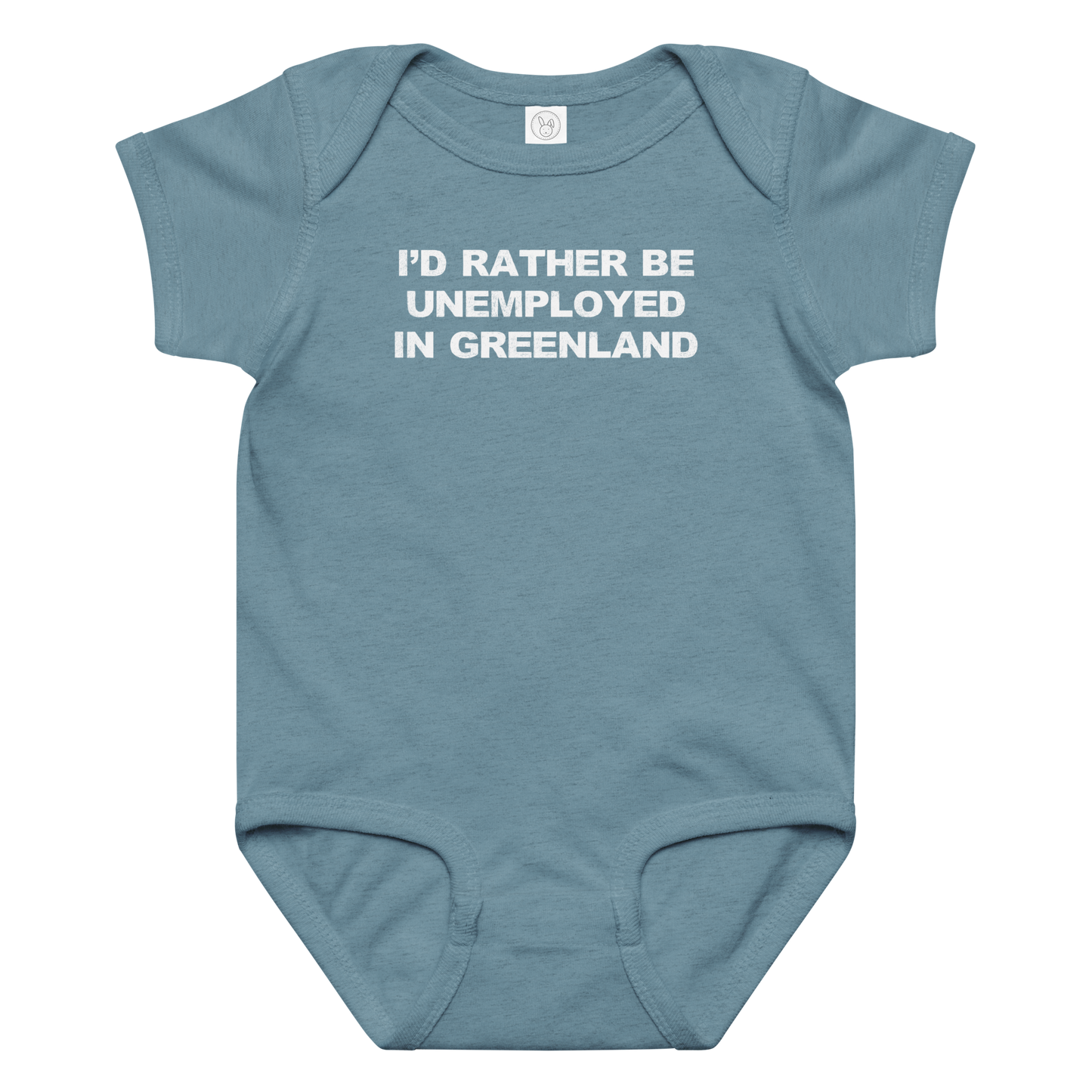 "I'd rather be unemployed in greenland" printed on a vintage indigo baby jersey bodysuit laying on a flat surface amongst other clothes