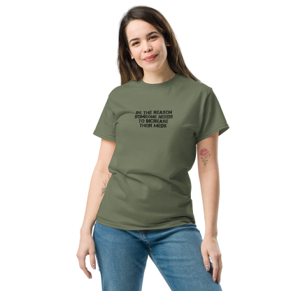 "Be the reason someone needs to increase their meds" printed on a military green unisex classic tee worn by a female