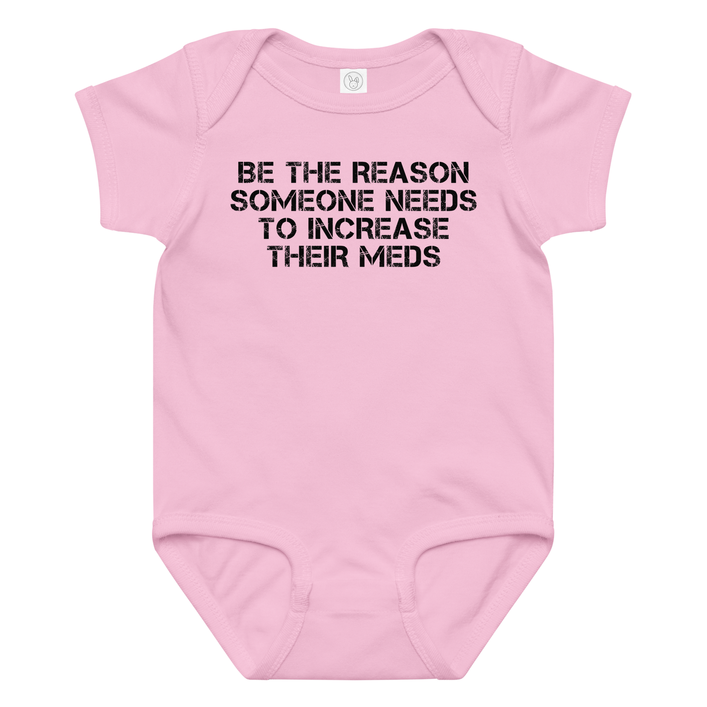 "Be the reason someone needs to increase their meds" printed on a pink baby jersey bodysuit laying on a flat surface amongst other clothes
