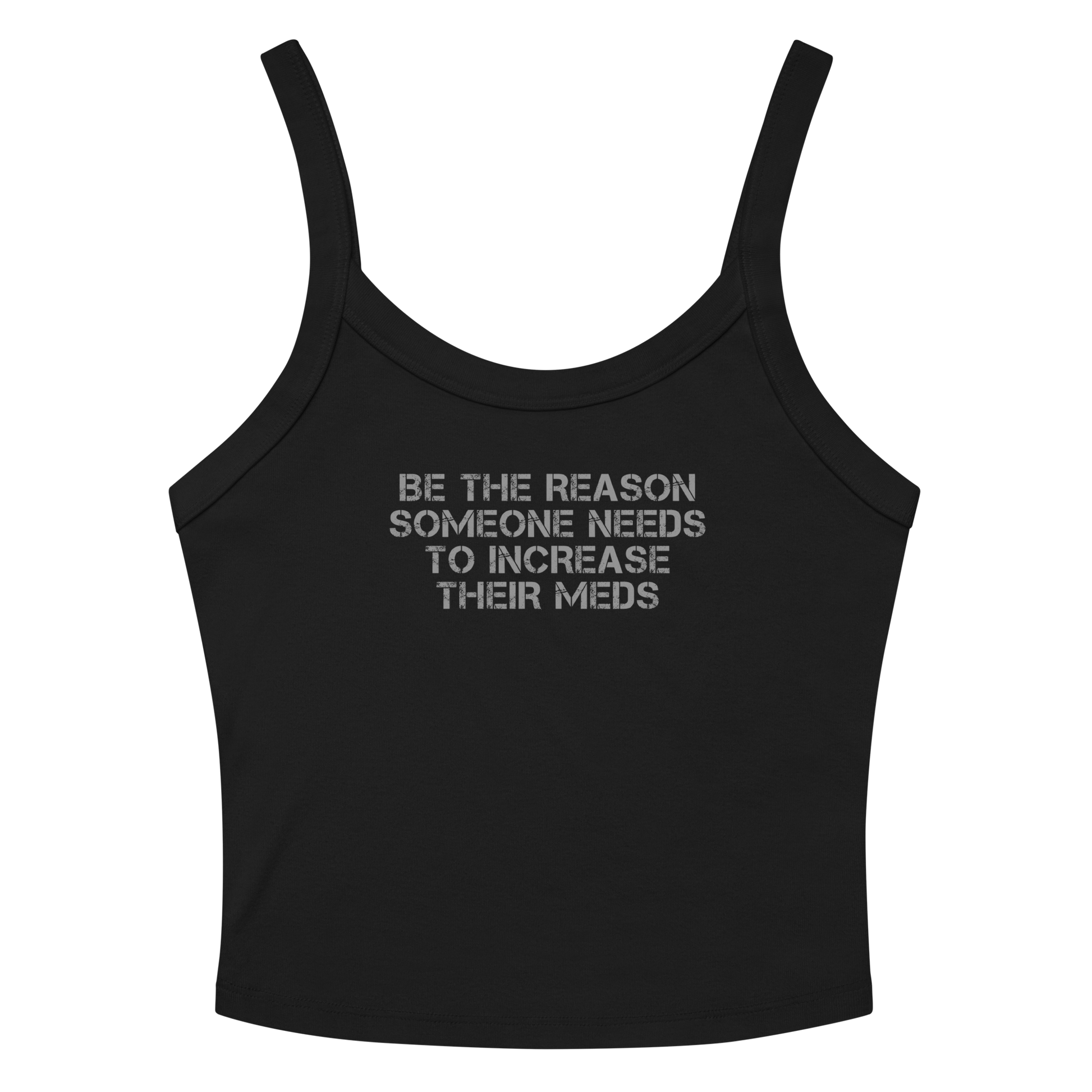 "Be the reason someone needs to increase their meds" printed on a solid black blend women's micro-rib tanktop laying on a flat surface amongst sunglasses and shorts