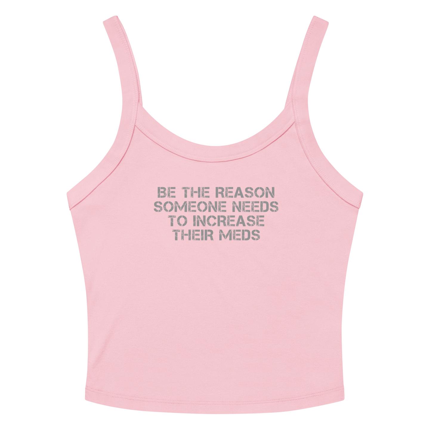 "Be the reason someone needs to increase their meds" printed on a solid pink blend women's micro-rib tanktop laying on a flat surface amongst sunglasses and shorts