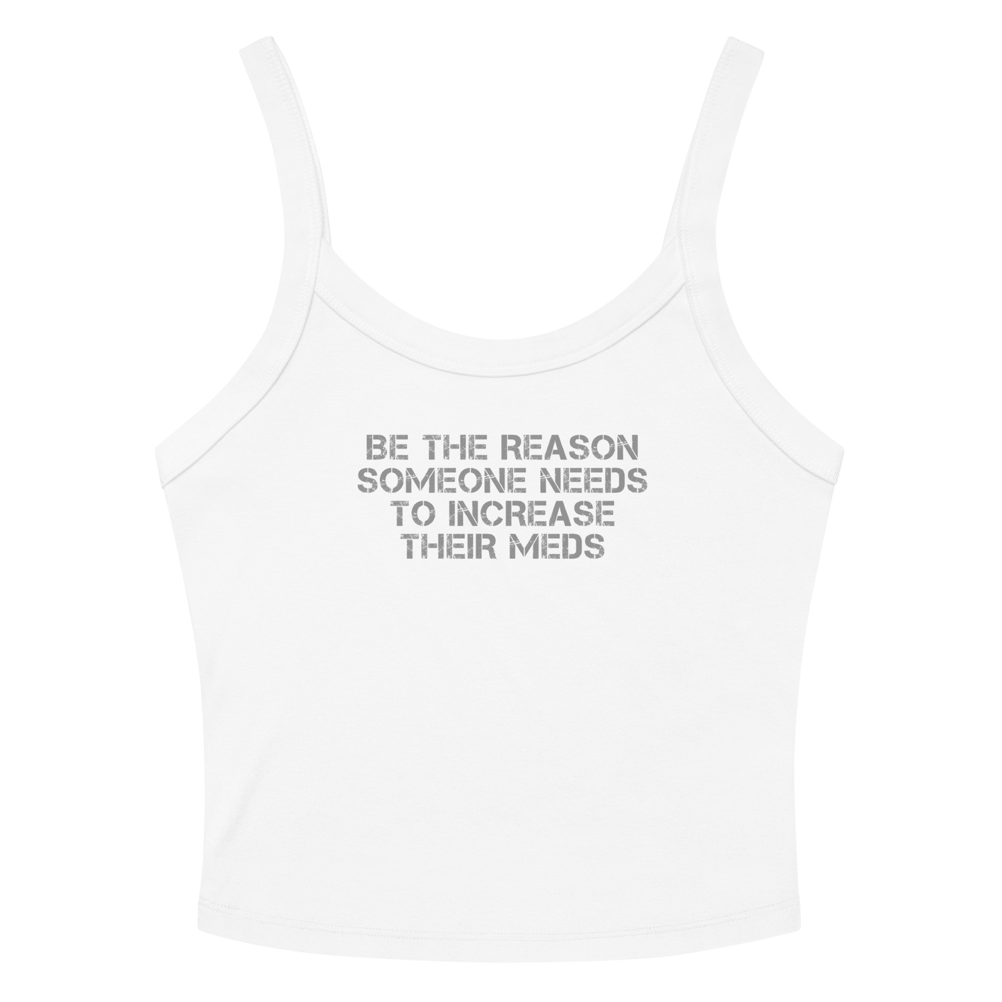 "Be the reason someone needs to increase their meds" printed on a solid white blend women's micro-rib tanktop laying on a flat surface amongst sunglasses and shorts