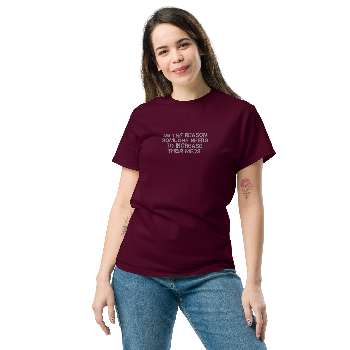 "Be the reason someone needs to increase their meds" printed on a maroon unisex classic tee worn by a female
