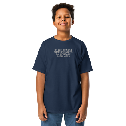 "Be the reason someone needs to increase their meds" printed on a navy youth classic tee worn by a male