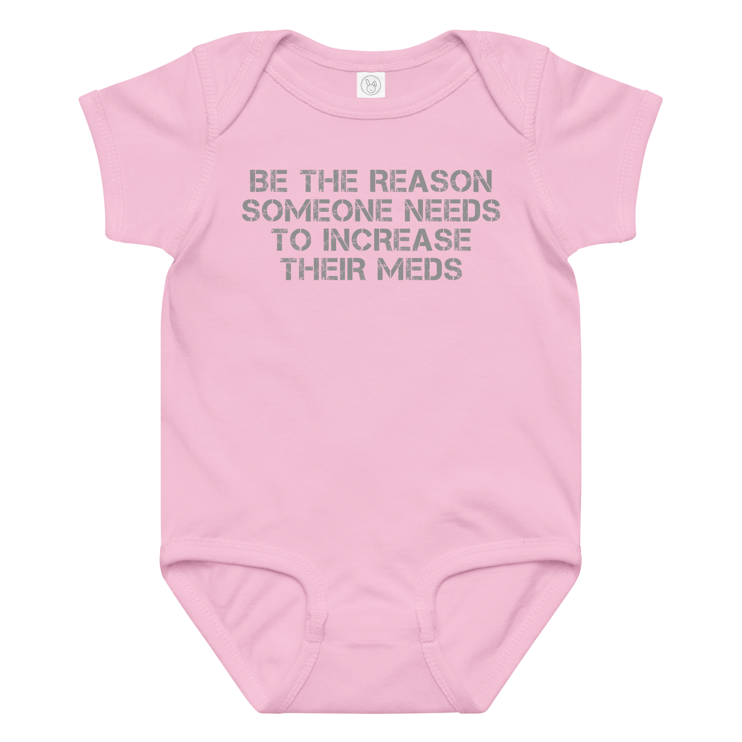 "Be the reason someone needs to increase their meds" printed on a pink baby jersey bodysuit laying on a flat surface amongst other clothes