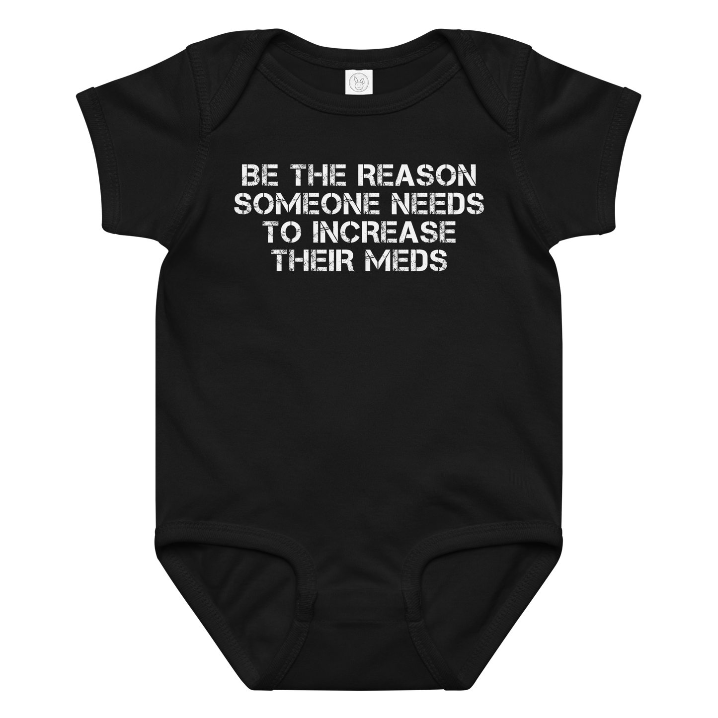 "Be the reason someone needs to increase their meds" printed on a black baby jersey bodysuit laying on a flat surface amongst other clothes