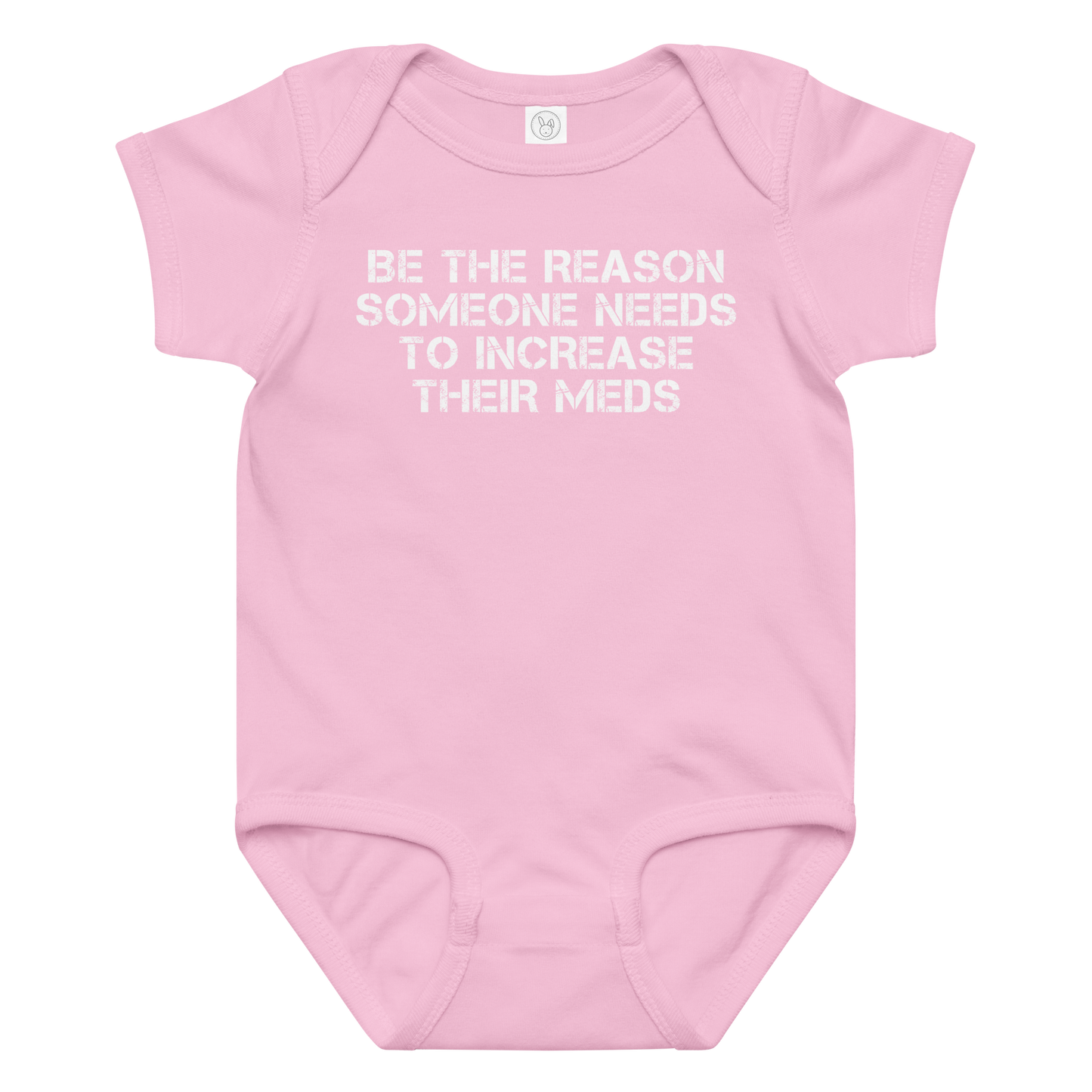 "Be the reason someone needs to increase their meds" printed on a pink baby jersey bodysuit laying on a flat surface amongst other clothes