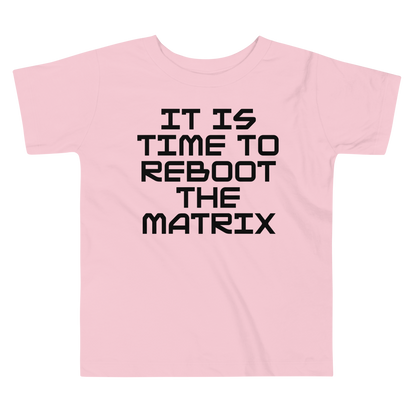 "It's time to reboot the matrix" printed on a pink toddler short sleeve tee laying on a flat surface