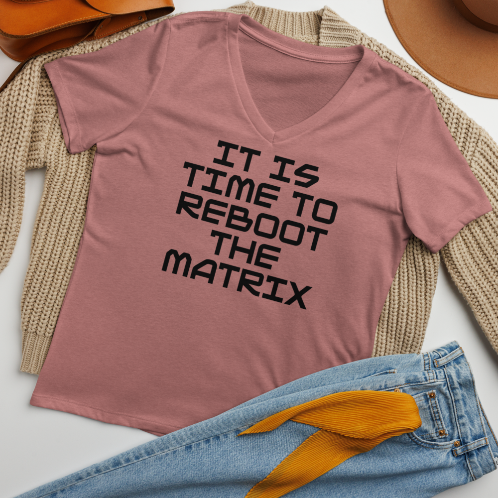 "It's time to reboot the matrix" printed on a heather mauve women's relaxed v-neck t-shirt laying on a flat surface amongst other clothes