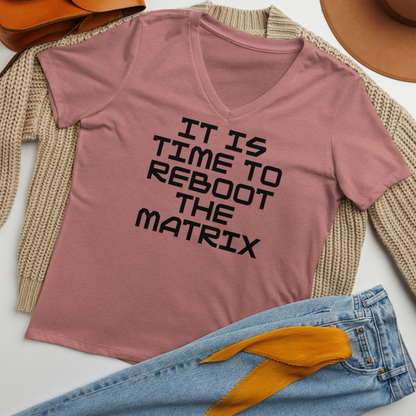 "It's time to reboot the matrix" printed on a heather mauve women's relaxed v-neck t-shirt laying on a flat surface amongst other clothes