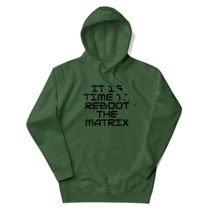 "It's time to reboot the matrix" printed on a forest green unisex hoodie laying on a flat surface with the hood up