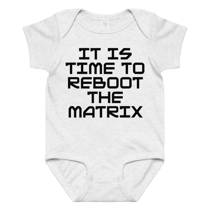 "It's time to reboot the matrix" printed on a ash baby jersey bodysuit laying on a flat surface amongst other clothes