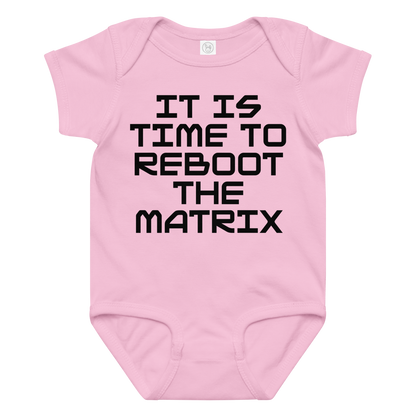 "It's time to reboot the matrix" printed on a pink baby jersey bodysuit laying on a flat surface amongst other clothes