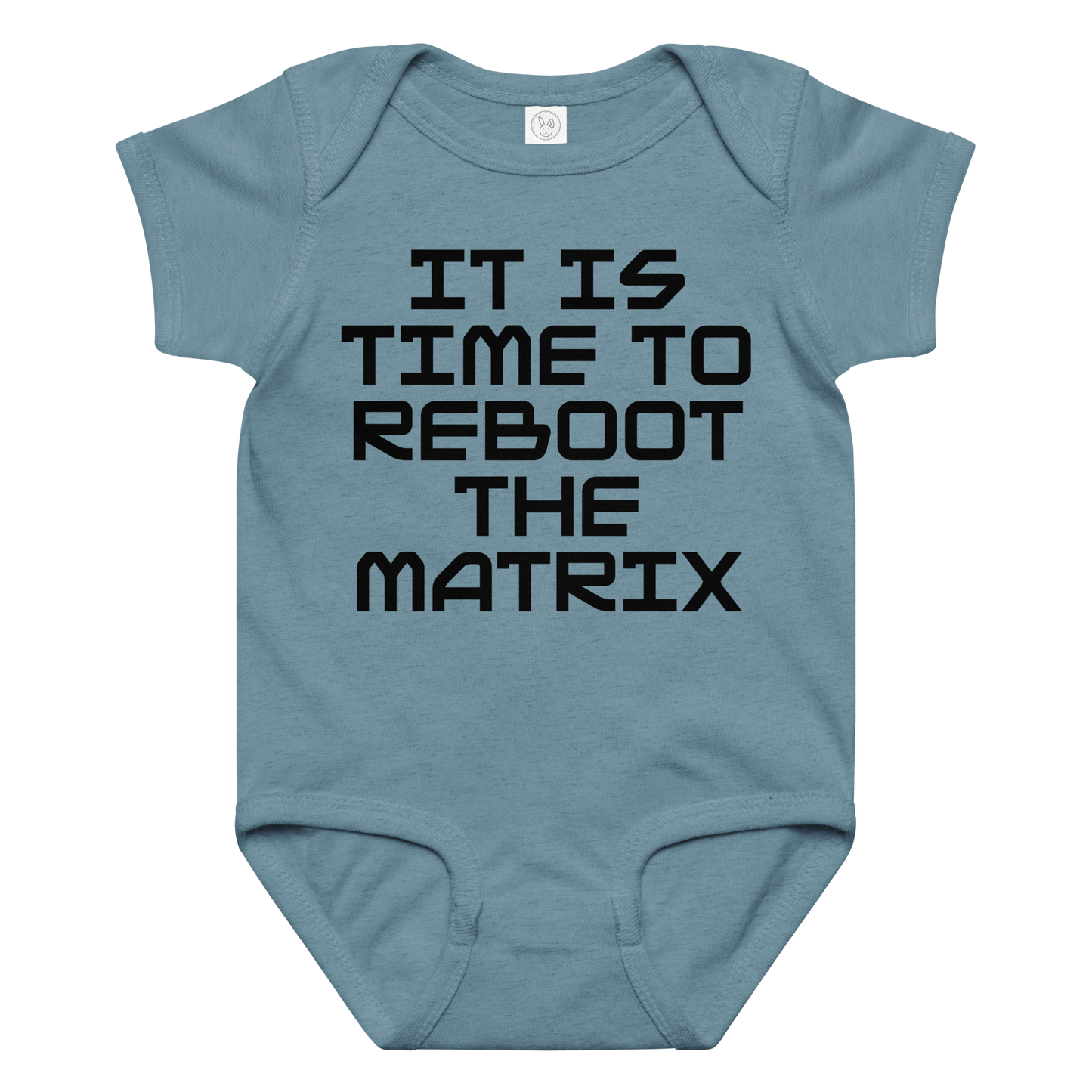 "It's time to reboot the matrix" printed on a vintage indigo baby jersey bodysuit laying on a flat surface amongst other clothes