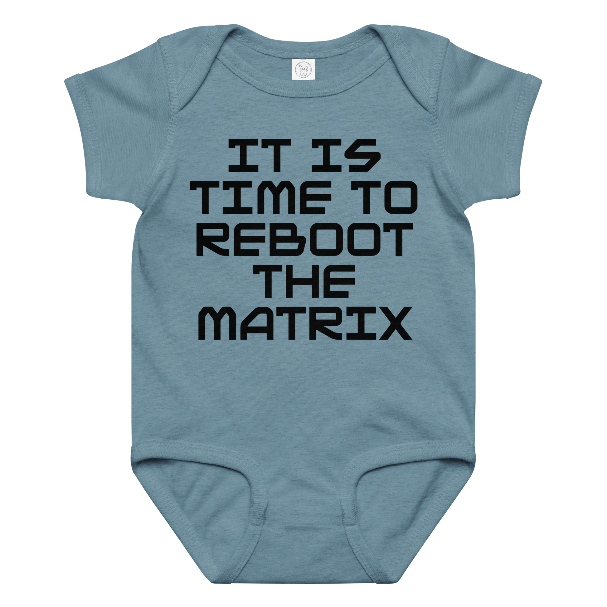 "It's time to reboot the matrix" printed on a vintage indigo baby jersey bodysuit laying on a flat surface amongst other clothes