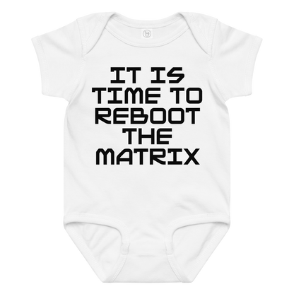 "It's time to reboot the matrix" printed on a white baby jersey bodysuit laying on a flat surface amongst other clothes