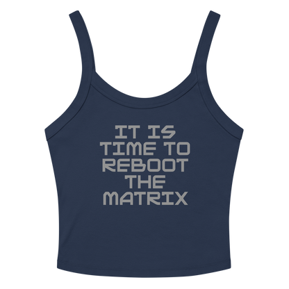 "It's time to reboot the matrix" printed on a solid navy blend women's micro-rib tanktop laying on a flat surface amongst sunglasses and shorts