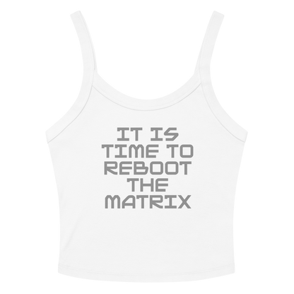 "It's time to reboot the matrix" printed on a solid white blend women's micro-rib tanktop laying on a flat surface amongst sunglasses and shorts