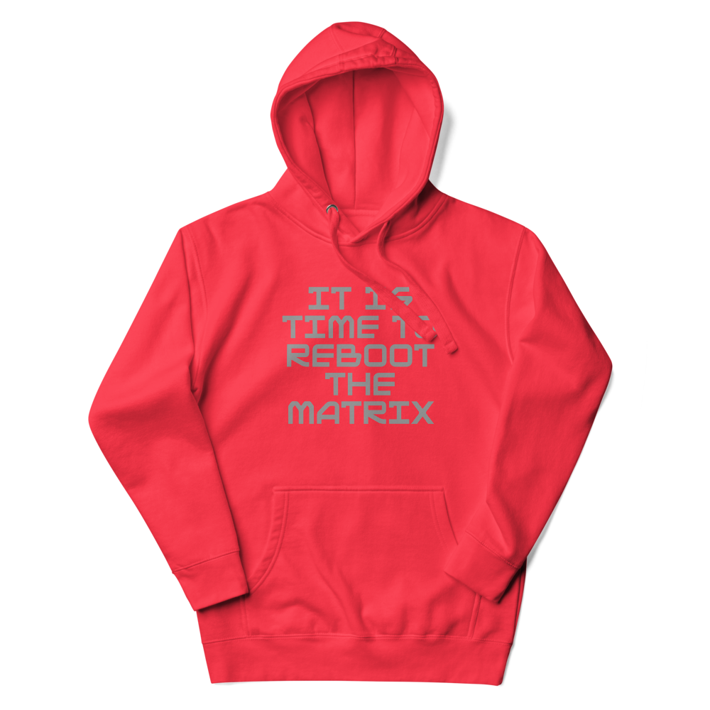 "It's time to reboot the matrix" printed on a team red unisex hoodie laying on a flat surface with the hood up