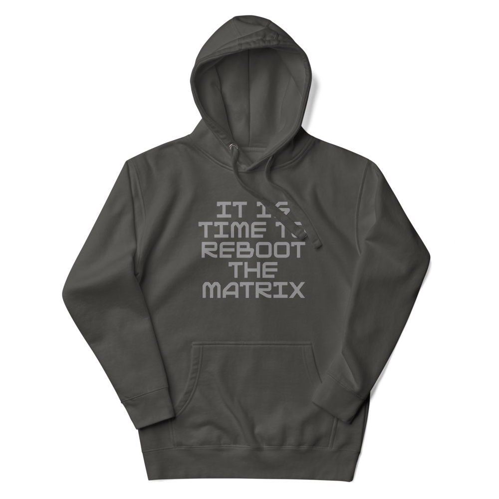 "It's time to reboot the matrix" printed on a vintage black unisex hoodie laying on a flat surface with the hood up