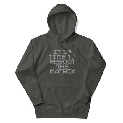 "It's time to reboot the matrix" printed on a vintage black unisex hoodie laying on a flat surface with the hood up