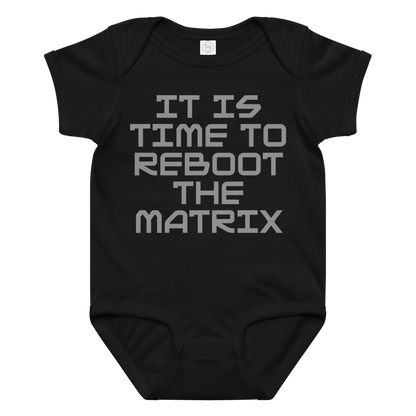 "It's time to reboot the matrix" printed on a black baby jersey bodysuit laying on a flat surface amongst other clothes