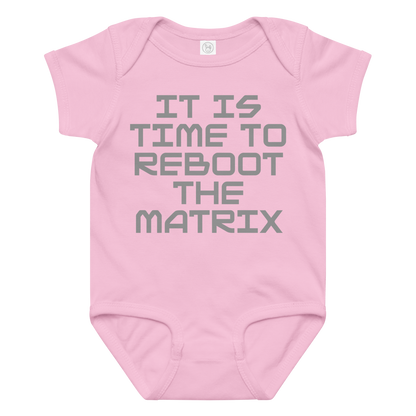 "It's time to reboot the matrix" printed on a pink baby jersey bodysuit laying on a flat surface amongst other clothes