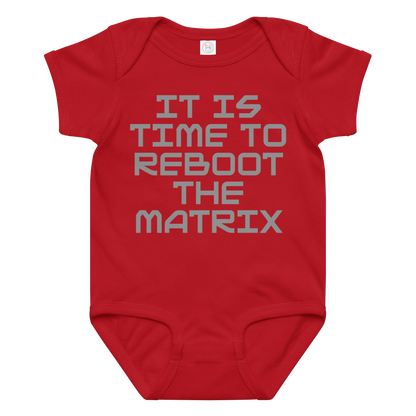 "It's time to reboot the matrix" printed on a red baby jersey bodysuit laying on a flat surface amongst other clothes