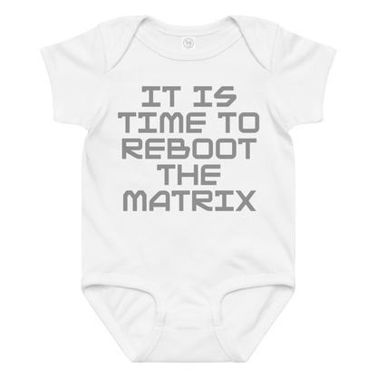 "It's time to reboot the matrix" printed on a white baby jersey bodysuit laying on a flat surface amongst other clothes