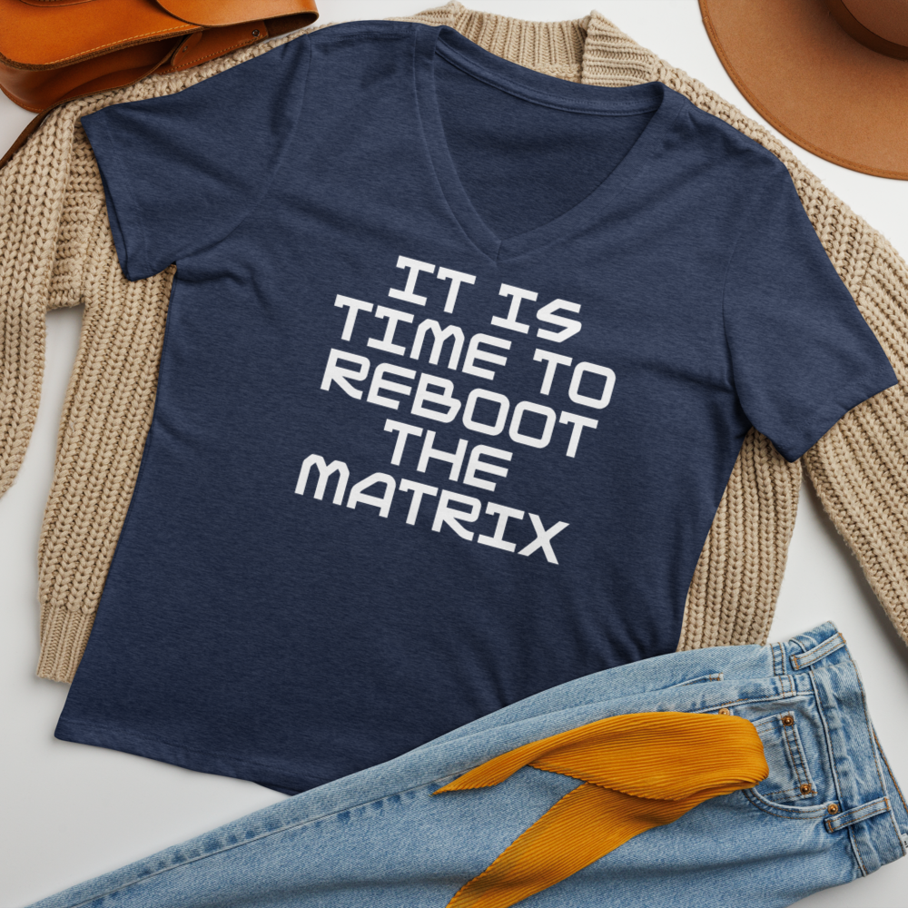 "It's time to reboot the matrix" printed on a heather navy women's relaxed v-neck t-shirt laying on a flat surface amongst other clothes