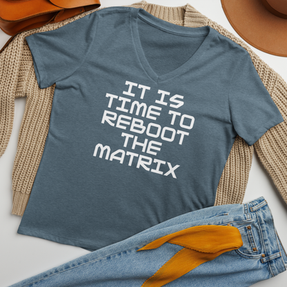 "It's time to reboot the matrix" printed on a heather slate women's relaxed v-neck t-shirt laying on a flat surface amongst other clothes
