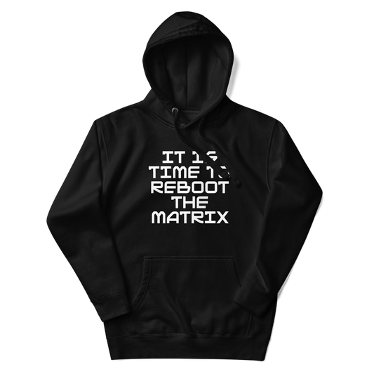 "It's time to reboot the matrix" printed on a black unisex hoodie laying on a flat surface with the hood up