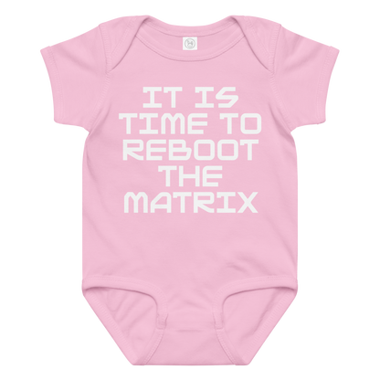 "It's time to reboot the matrix" printed on a pink baby jersey bodysuit laying on a flat surface amongst other clothes