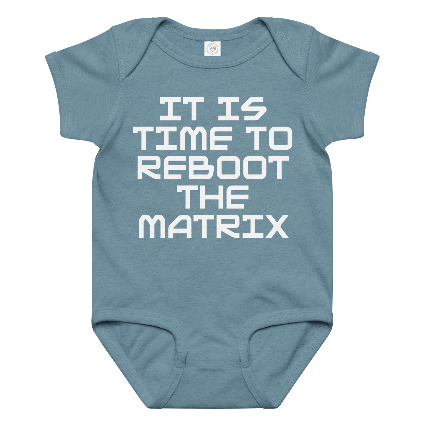 "It's time to reboot the matrix" printed on a vintage indigo baby jersey bodysuit laying on a flat surface amongst other clothes