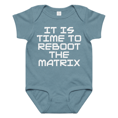 "It's time to reboot the matrix" printed on a vintage indigo baby jersey bodysuit laying on a flat surface amongst other clothes