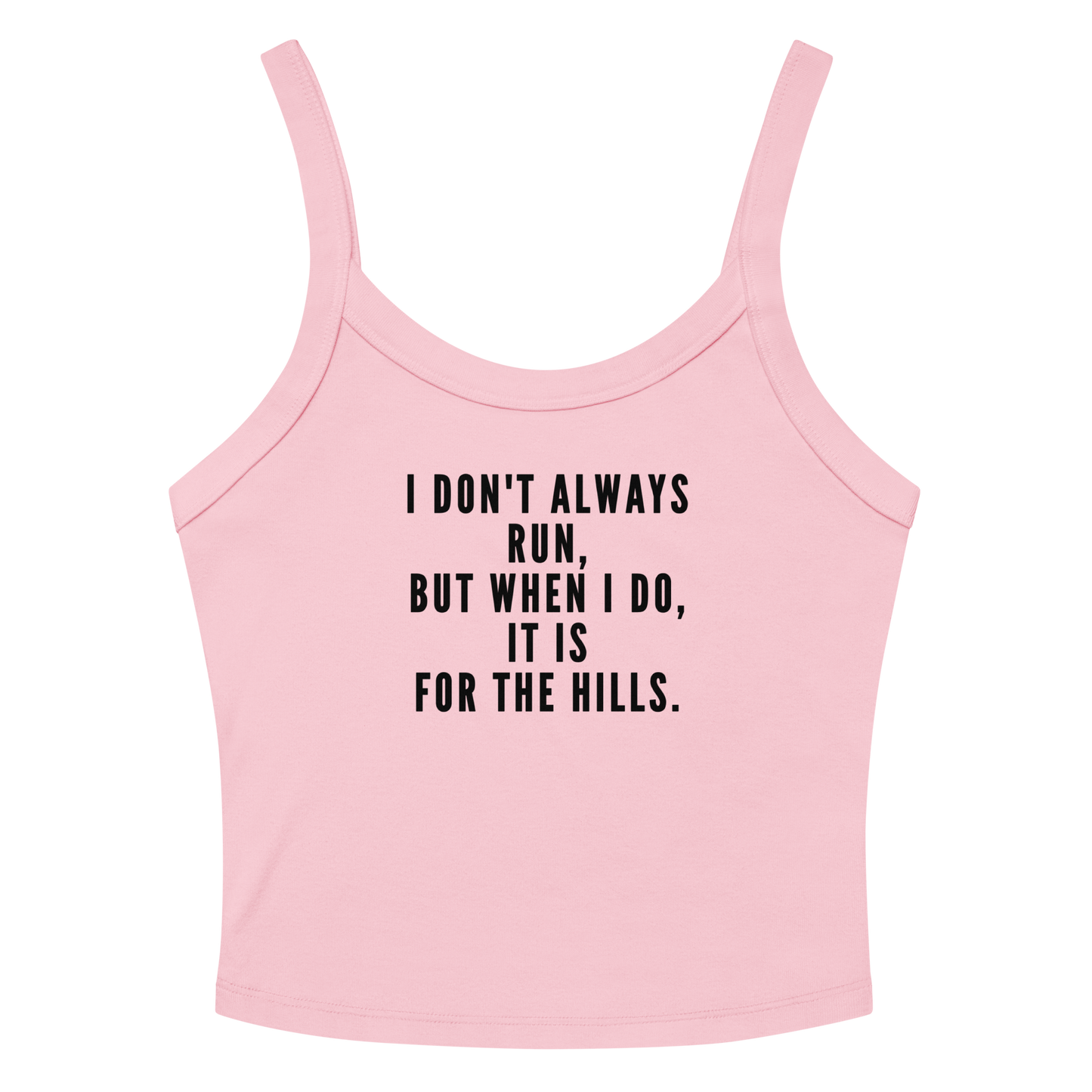 "I don't always run, but when I do, it is for the hills." printed on a solid pink blend women's micro-rib tanktop laying on a flat surface amongst sunglasses and shorts